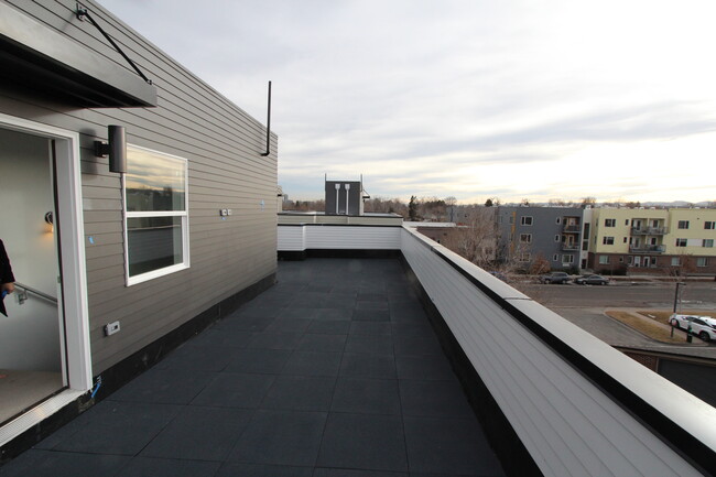 rooftop patio, view of front range and downtown - 1919 W 46th Ave