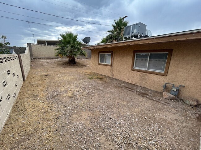 Building Photo - Single story home with large backyard and huge carport with plenty of storage.