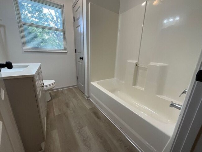 Building Photo - **Spacious 4BR with Modern Upgrades & Cove...