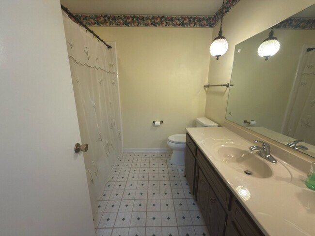 Building Photo - Spacious three bedroom, two bathroom with ...