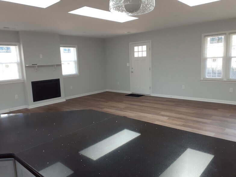 LR, skylights, door, fireplace - 200 Adair St