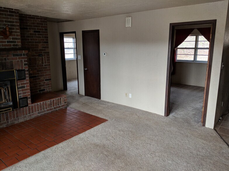 Living Room. We are replacing the carpet with premium LVP. - 5235 Highway NN