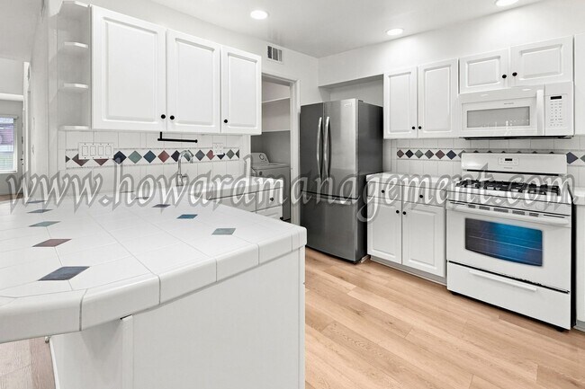 Building Photo - LAKE VIEW in LA! Majestic townhouse with high ceilings, three patios and lake view!