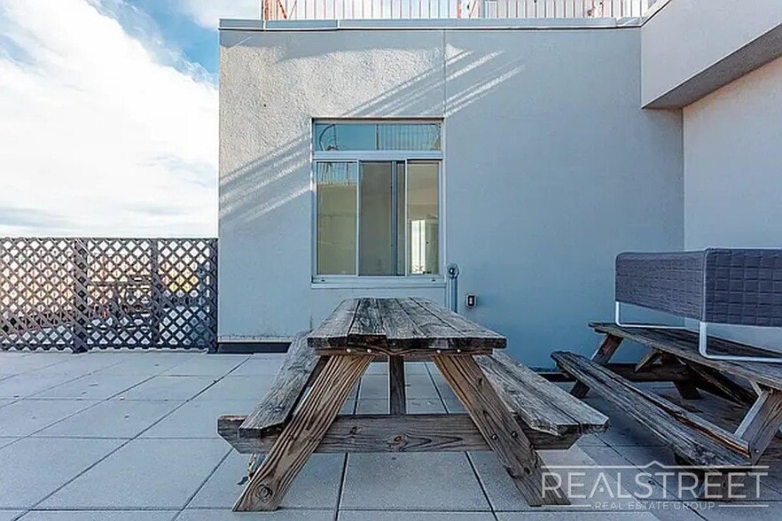 Building Photo - Massive Outdoor Patio | Spacious 3BR/2BA Apartment in Bushwick–East Williamsburg