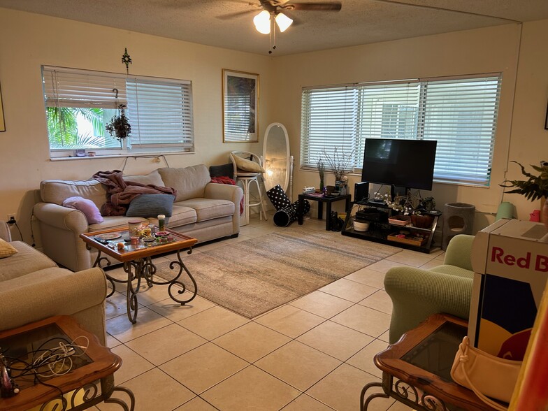 living room with sofa and loveseat and smart TV - 265 SW 7th St