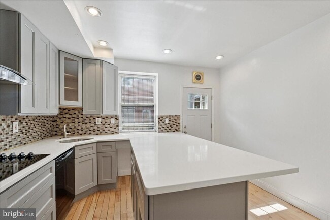 Building Photo - Updated 2BR Townhome with Dual Ensuite Baths, Hardwood Floors & Private Patio in Grays Ferry