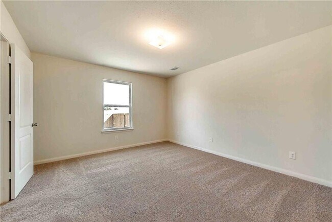 Building Photo - This lovely 4 bedroom home features a large family room with lots of light.