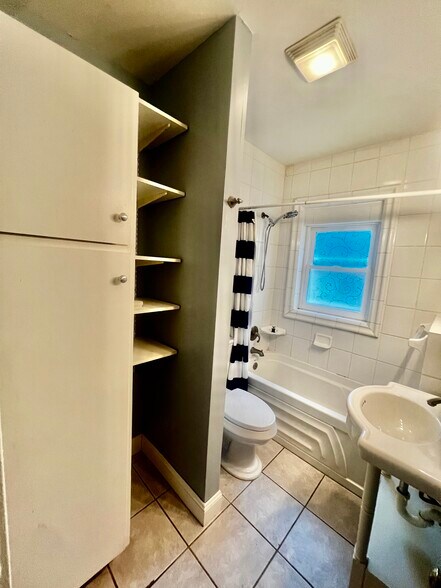 Designed to maximize storage space with shelving and utility cabinet - 2107 Maury Ave