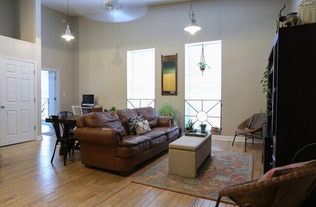 living area with large windows - 903 Main St