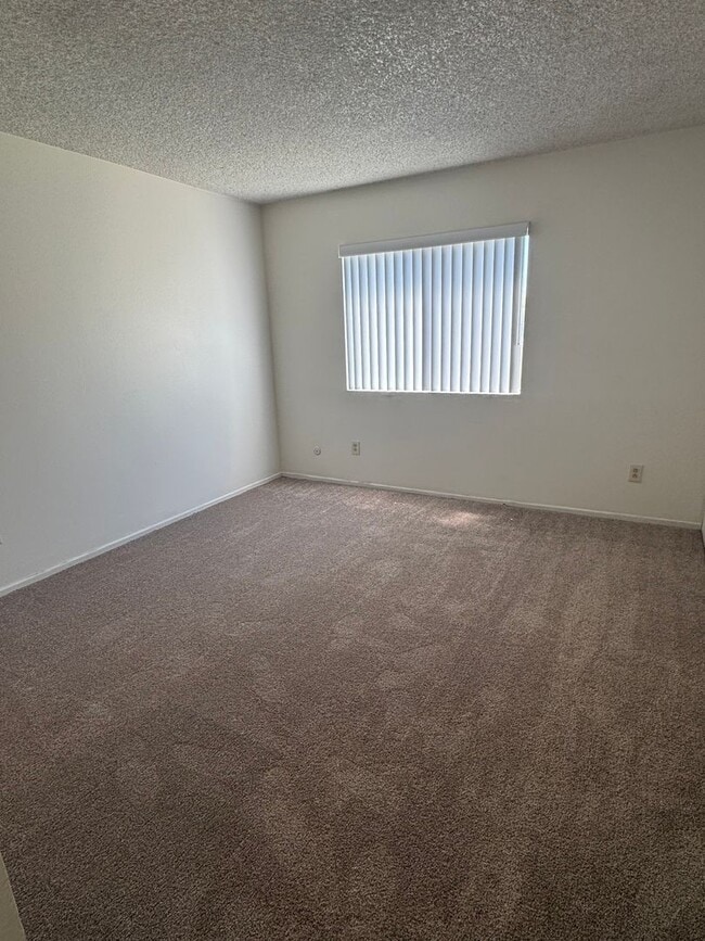 Building Photo - Upstairs two-bedroom 1/12 bath condo avail...