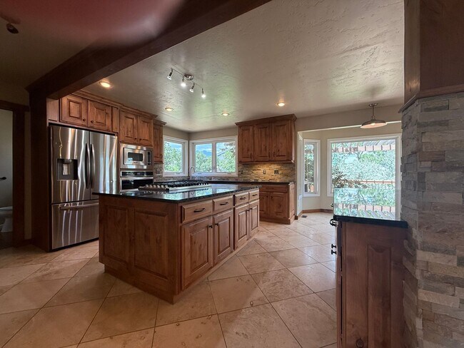 Building Photo - 5BD/4BA/3 car garage w Flat Yard Cheyenne ...