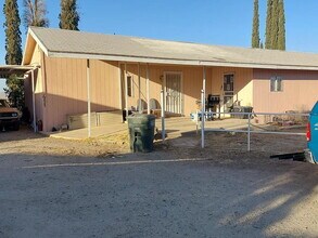 Building Photo - "Charming 3-Bedroom Haven with Cozy Fireplace in Maricopa – Spacious 2264 Sq Ft Retreat!"
