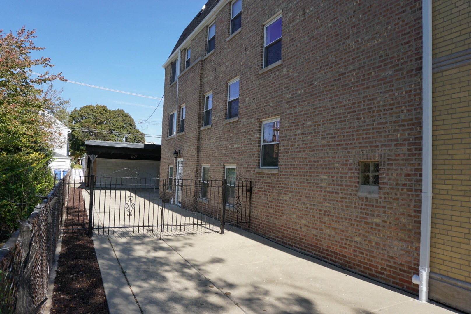 side entrance to the parking spot - 6626 W Devon Ave