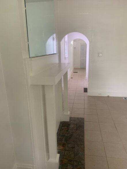 Hallway past owners access door and first bedroom - 911 Putnam St