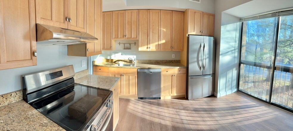 Kitchen is full on natural light with area for breakfast nook - 11557 Rolling Green Ct