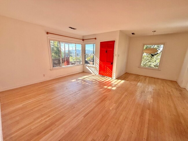 Building Photo - Hilltop Highland Park Sanctuary with Views, Private Gated Yard, In Unit Laundry, Parking & Abunda...