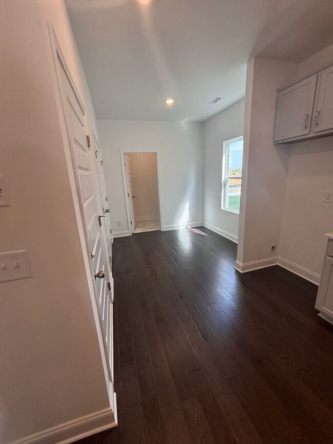 Building Photo - **BE THE LUCKY ONE TO LIVE IN THIS 2024-BUILT END-UNIT TOWNHOME IN A RESORT-STYLE COMMUNITY**