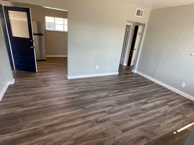 Building Photo - OPEN HOUSE! Remodeled Two Bedroom, End Unit with A/C and Large Fenced Yard