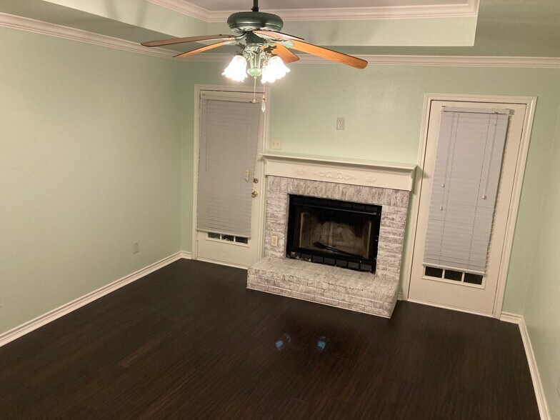 Master bedroom includes fireplace, mantle, and door to backyard. - 16485 County Road 164