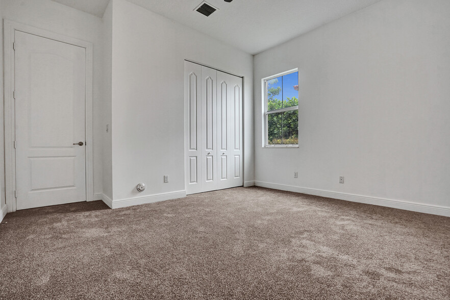 Guest Bedroom (1st floor - closet view) - 6455 SW 55th Pl