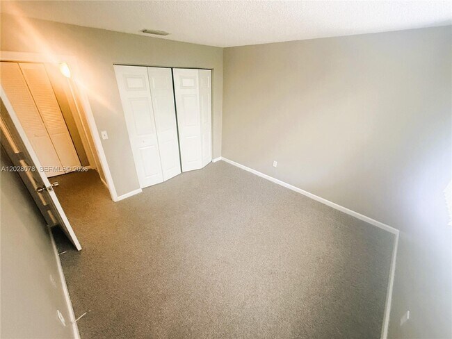 Building Photo - 10787 Royal Palm Blvd