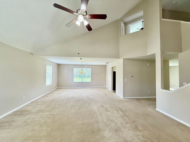 Building Photo - LARGE AND SPACIOUS 4/3 HOME IN EAST ORLANDO WEDGEFIED COMMUNITY