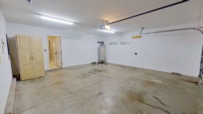 Building Photo - Beautiful home boasts open floorplan, screened porch, and spacious fenced yard