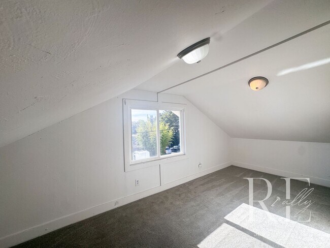 Building Photo - Light-Filled Home with Vaulted Ceilings, Bonus Basement & Walkable Location