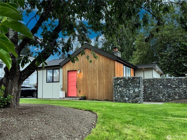 Building Photo - Remodeled 3 bdrm home on a large lot with 500 sq ft wrap around deck!