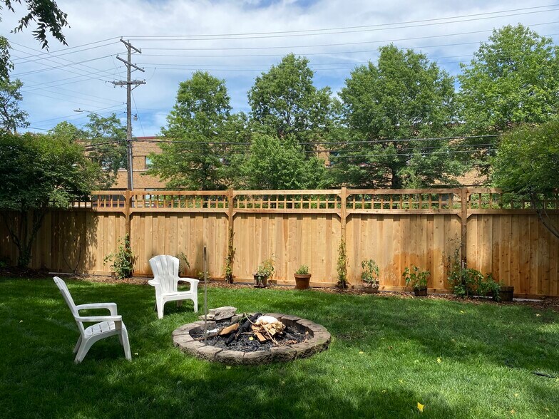 Fully fenced backyard with fire pit. - 2800 S 32nd Ave