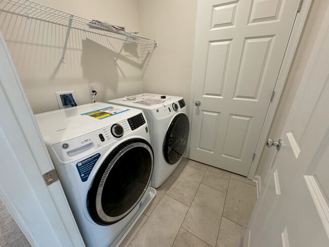 Laundry room and door to utilities room - 111 Peyton Pl