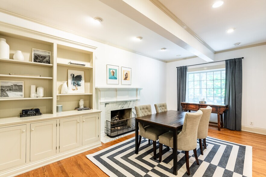 Informal dining with fireplace. - 4061 Beechwood Ave