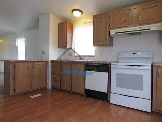 Building Photo - 2 Bed 1 Bath Mobile with Fenced Yard and Storage Shed!