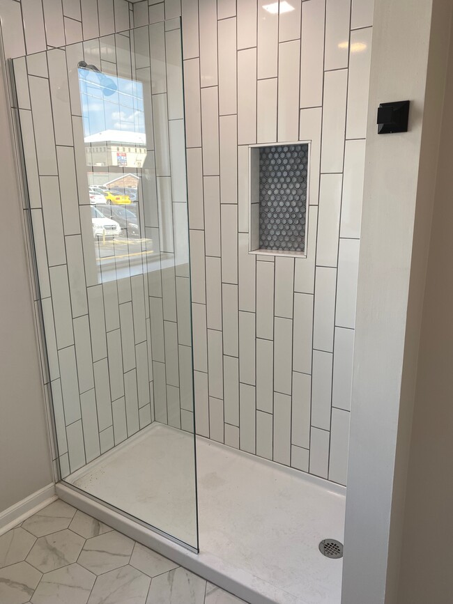 Walk-In Showers with floor to ceiling tile - 8th Street Apartments