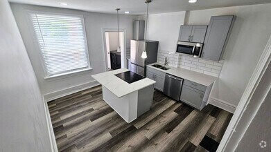 Building Photo - Fully renovated...extra half bath...laundr...