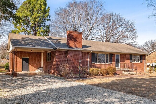 Building Photo - Elon - Large Brick Home, Hardwoods, Granite Counter-Tops, SS Appliances, Fire Place, Carport - Mu...