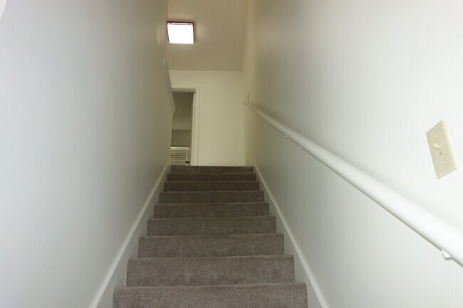 Heading upstairs where you have two bedrooms, full bath, and landing area with lots of storage - 3421 E 35th St