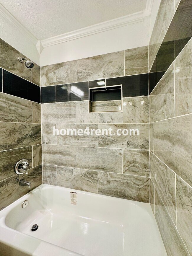 Building Photo - Lovely Three Bedroom Home in KCMO and an Updated Kitchen  w/ Granite and SS Appliances, including...