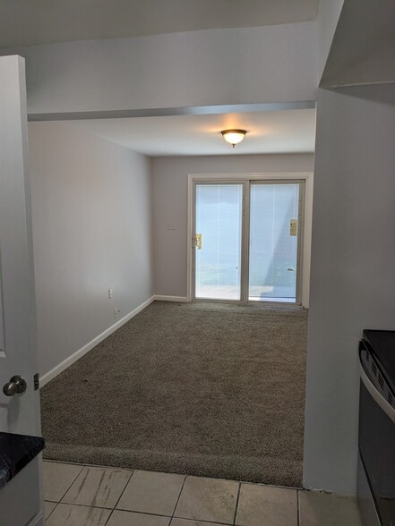 Living room and sliding doors to the deck - 520 E Miner St