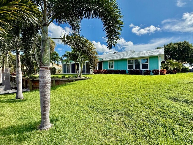 Building Photo - Palm City Home with Dock and Lift