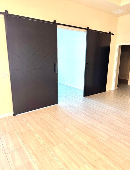 New doors for the bonus room in living room photo facing pool - 2037 Yellowfin Cir