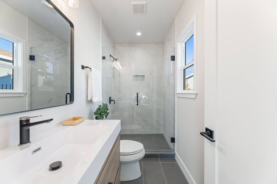 Completely newly renovated Master bedroom en-suite bathroom with luxury shower and natural light. - 1823 N Ditman Ave