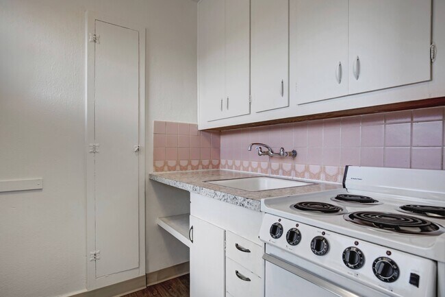 Kitchen with Pink Tile Backsplash - Olive Tower
