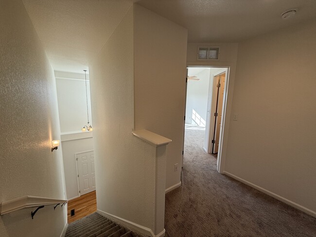 Top of stairs with master bedroom and bathroom - 8690 Ethan Aly