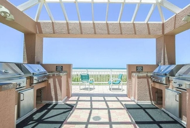 Building Photo - Newly Renovated Beachfront Condo with Stun...