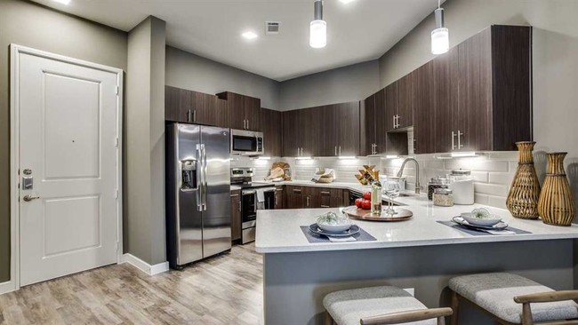 Spacious eat in kitchen with stainless steel appliances. - Junction at Galatyn Park