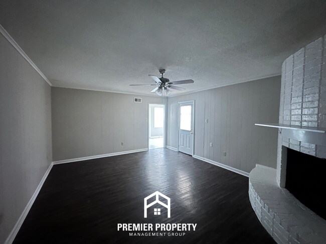 Building Photo - Charming 3BR Memphis Home | Rustic Brick Fireplace, Formal Dining & Fenced Backyard