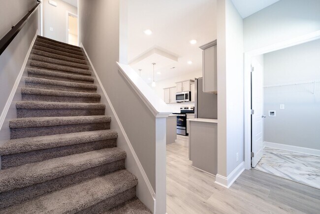 Building Photo - Elegant Home with Stone Fireplace, Kitchen Island and Designer Primary Suite