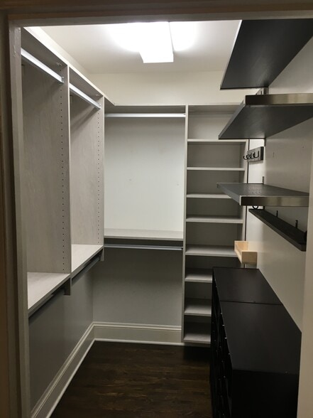Walk-in closet in primary bedroom - 1627 Nassau Blvd
