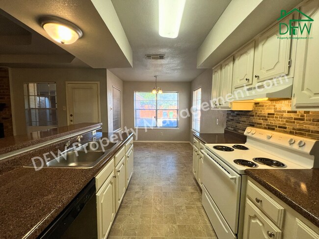 Building Photo - Charming Single-Story 2/2 Duplex with 2-Car Garage Just Steps from Your Back Door – Arlington, TX